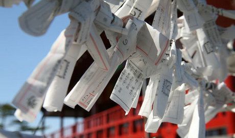 People purchase paper from the shrine, write their wishes, and tie them to ropes.